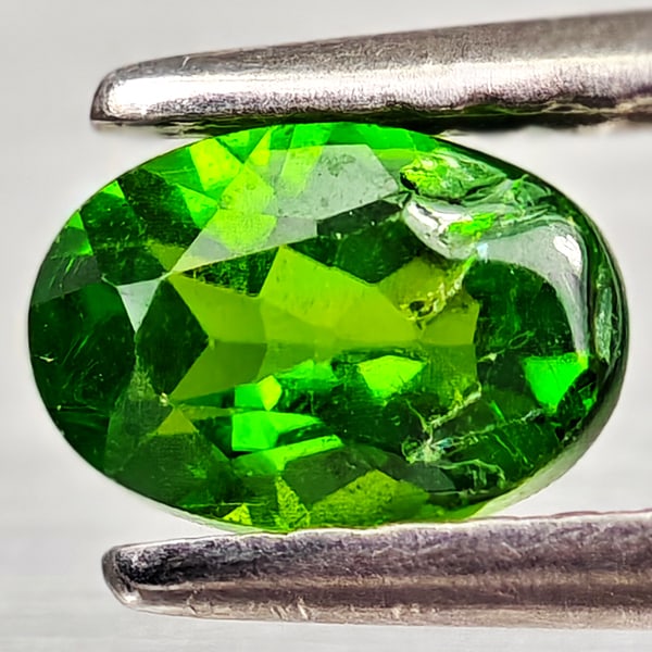 Natural Green Chrome Diopside 0.58 Ct. Oval Shape 6.1 x 4.1 Mm Gemstone From Russia: Product ID: 801608173 Product Name: Natural Chrome Diopside Weight: 0.58 CT. Size: 6.1 x 4.1 x 3 MM. Shape: Oval Color: Green Clarity:VSI - SI1 Luster: Good Gems Origin: Russia Treatment: Unheated Cry