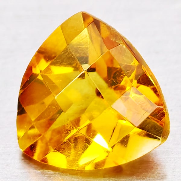 Natural Yellow Citrine 0.71 Ct. Trilliant Checkerboard Cut 6.1 Mm Gemstone From Brazil: Product ID: 801815187 Product Name: Natural Citrine Weight: 0.71 CT. Size: 6.1 x 6.1 x 4 MM. Shape: Trilliant Checkerboard Cut Color: Yellow Clarity:VVS - VSI Luster: Good Gems Origin: Brazil Treatmen