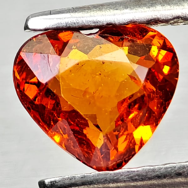 Natural Orangish Red Spessartine Garnet 0.96 Ct Heart Shape 6.2 x 5.6 Mm Gemstone from Namibia: Product ID: 802936813 Product Name: Natural Spessartine Weight: 0.96 CT. Size: 6.2 x 5.6 x 3.1 MM. Shape: Heart Shape Color: Orangish Red Clarity:VSI Luster: Good Gems Origin: Namibia,Africa Treatment