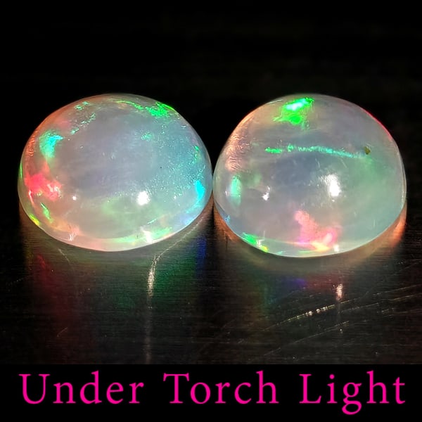 Natural Multi Color Opal 1.44 Ct. 2 Pcs Round Cabochon Shape 6.9 Mm Gemstones from Ethiopia: Product ID: 818728268 Product Name: Natural Opal Weight: 1.44 CT. Size: 6.9 x 6.9 x 3.7 MM. Shape: Round Color: Multi-Color Clarity:Semi - Transparent Luster: Good Gems Origin: Ethiopia Treatment: Unh