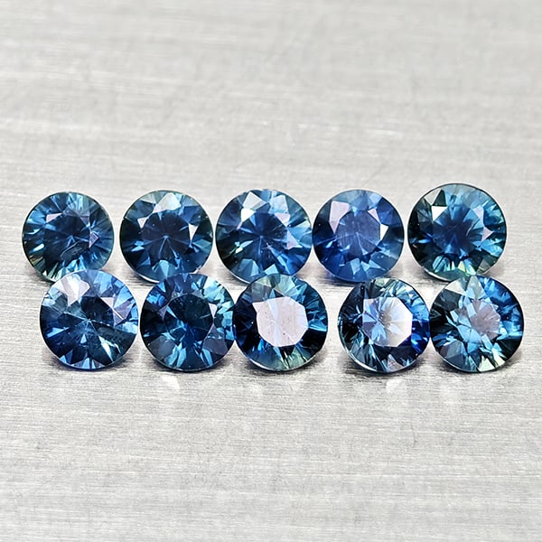 Natural Blue Sapphire 0.80 Ct. 10 Pcs Round Diamond Cut 2.7 Mm Gemstones From Madagascar: Product ID: 806162605 Product Name: Natural Blue Sapphire Weight: 0.80 CT. Size: 2.7 x 2.7 x 1.8 MM. Shape: Round Diamond Cut Color: Blue Clarity:VVS Luster: Good Gems Origin: Madagascar Treatment: He