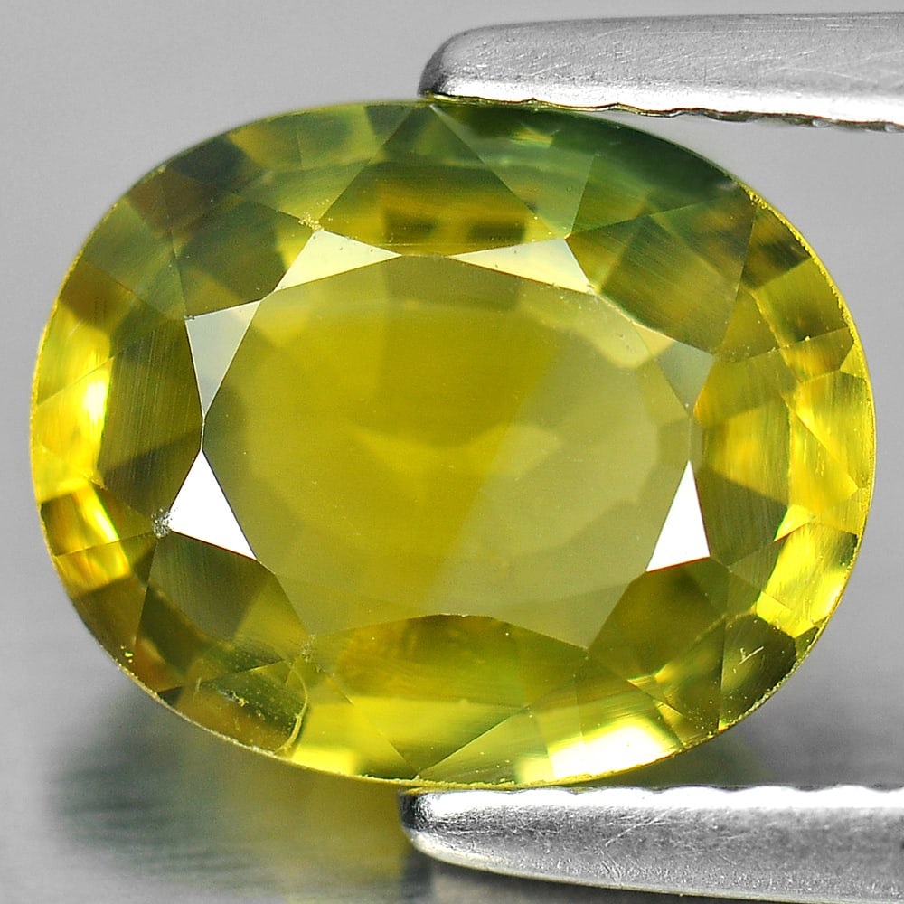 Natural Greenish Yellow Sapphire 2.57 Ct. VS Oval Shape 9.5 x 7.6 Mm. Gemstone From Thailand: Product ID: 806152611 Product Name: Natural Yellow Sapphire Weight: 2.57 CT. Size: 9.5 x 7.6 x 3.6 MM. Shape: Oval Color: Greenish Yellow Clarity:VS Luster: Very Good Gems Origin: Thailand Treatment: 