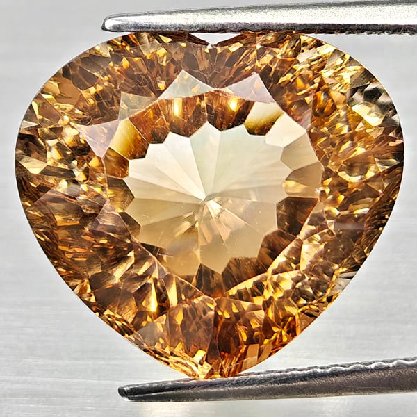 Natural Imperial Topaz 14.64 Ct. Heart Concave Cut 15.7 x 14 Mm Gemstone From Brazil: Product ID: 807168253 Product Name: Natural Topaz Weight: 14.64 CT. Size: 15.7 x 14 x 9.6 MM. Shape: Heart Concave Cut Color: Imperial Clarity:VSI Luster: Very Good Gems Origin: Brazil Treatment: Unhe