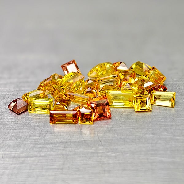 Natural Orange Yellow Sapphire 3.88 Ct. 37 Pcs Mixed Shape Gemstones From Tanzania: Product ID: 806161917 Product Name: Natural Fancy Color Sapphire Weight: 3.88 CT. Size: 4.1 x 2.3 x 1.5 MM. Shape: Mixed Shape Color: Orange Yellow Clarity:VSI Luster: Good Gems Origin: Tanzania Treat