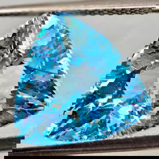 Natural Swiss Blue Topaz 6.94 Ct. Trilliant Shape 12.9 Mm Gemstone From Brazil: Product ID: 807167920 Product Name: Natural Blue Topaz Weight: 6.94 CT. Size: 12.9 x 12.9 x 7.3 MM. Shape: Trilliant Color: Swiss Blue Clarity:VSI Luster: Good Gems Origin: Brazil Treatment: Treated C