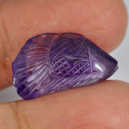 Natural Violet Amethyst 8.50 Ct. Fish Carving 20 x 11.3 Mm. Gemstone From Brazil: Product ID: 810303001 Product Name: Natural Amethyst Weight: 8.50 CT. Size: 20 x 11.3 x 6.8 MM. Shape: Fish Carving Color: Violet Clarity:Semi - Transparent Luster: Good Gems Origin: Brazil Treatment: