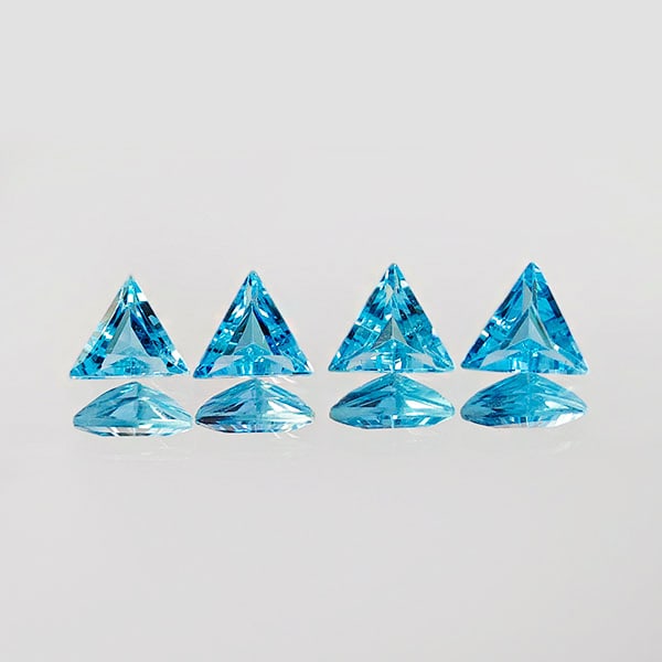 Natural Swiss Blue Topaz 2.02 Ct. 4 Pcs. VVS Shape 5.6 x 5.6 Mm. Gemstones From Brazil: Product ID: 807167764 Product Name: Natural Blue Topaz Weight: 2.02 CT. Size: 5.6 x 5.6 x 2.8 MM. Shape: Trilliant Color: Blue Clarity:VVS Luster: Good Gems Origin: Brazil Treatment: Treated Crystal S