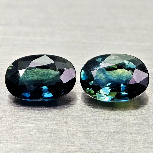 Natural Blue Green Sapphire 1.12 Ct. 2 Pcs Oval Shape 6 x 4 Mm. Gemstones From Thailand: Product ID: 806012135 Product Name: Natural Blue Sapphire Weight: 1.12 CT. Size: 6 x 4 x 2.5 MM. Shape: Oval Color: Blue Green Clarity:VSI Luster: Good Gems Origin: Thailand Treatment: Heated Crystal