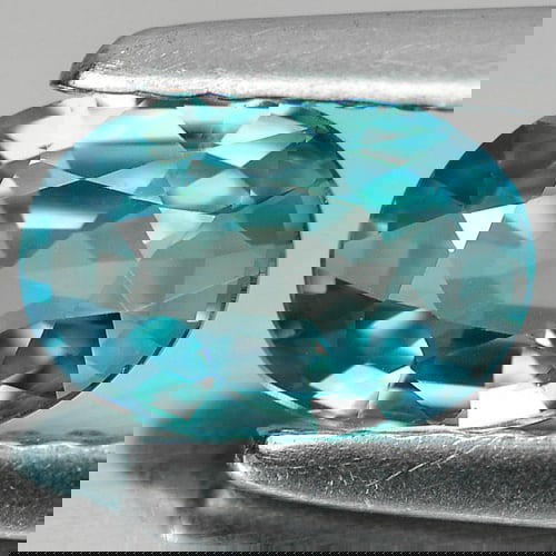 Natural Blue Zircon 0.97 Ct. VVS Oval Shape 7 x 4.8 Mm. Gemstone From Cambodia: Product ID: 807724206 Product Name: Natural Zircon Weight: 0.97 CT. Size: 7 x 4.8 x 2.7 MM. Shape: Oval Color: Blue Clarity:VVS Luster: Good Gems Origin: Cambodia Treatment: Heated Crystal Structure: