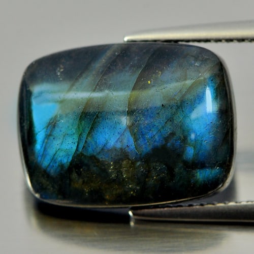 Multi Color Blue Labradorite Doublet 9.46 Ct. Baguette Cabochon Shape 16 x 11.9 Mm Gemstone from: Product ID: 804301157 Product Name: Natural Labradorite Weight: 9.46 CT. Size: 16 x 11.9 x 5.1 MM. Shape: Baguette Cabochon Color: Multi-Color Clarity:Opaque Luster: Iridescent Gems Origin: Canada Tre