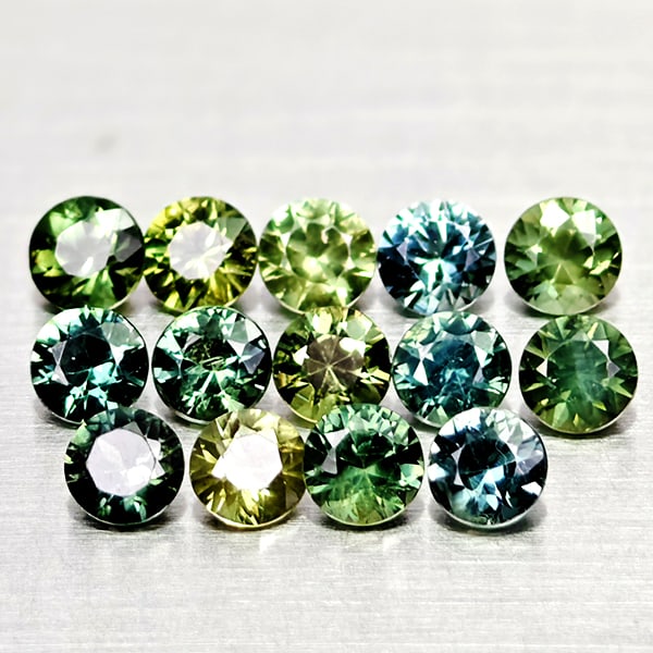 Natural Green Sapphire 2.15 Ct. 14 Pcs Round Diamond Cut 3.2 Mm Gemstones From Thailand: Product ID: 806162492 Product Name: Natural Green Sapphire Weight: 2.15 CT. Size: 3.2 x 3.2 x 2.3 MM. Shape: Round Diamond Cut Color: Green Clarity:VSI Luster: Good Gems Origin: Thailand Treatment: He