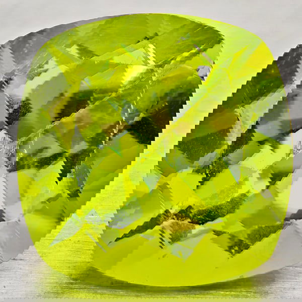 Natural Green Peridot 1.69 Ct. Cushion Shape 7.2 Mm Gemstone From Pakistan: Product ID: 805317258 Product Name: Natural Peridot Weight: 1.69 CT. Size: 7.2 x 7.2 x 4.8 MM. Shape: Cushion Shape Color: Green Clarity:VSI - SI1 Luster: Good Gems Origin: Pakistan Treatment: Unheate