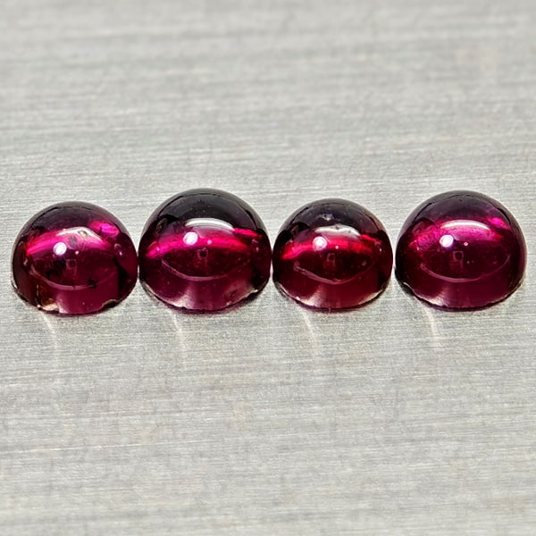 Natural Purplish Pink Rhodolite Garnet 2.10 Ct. 4 Pcs Round Cabochon Shape 4.3 Mm Gemstones: Product ID: 802936770 Product Name: Natural Rhodolite Weight: 2.10 CT. Size: 4.3 x 4.3 x 2.7 MM. Shape: Round Cabochon Color: Purplish Pink Clarity:Semi - Transparent Luster: Good Gems Origin: Madagas