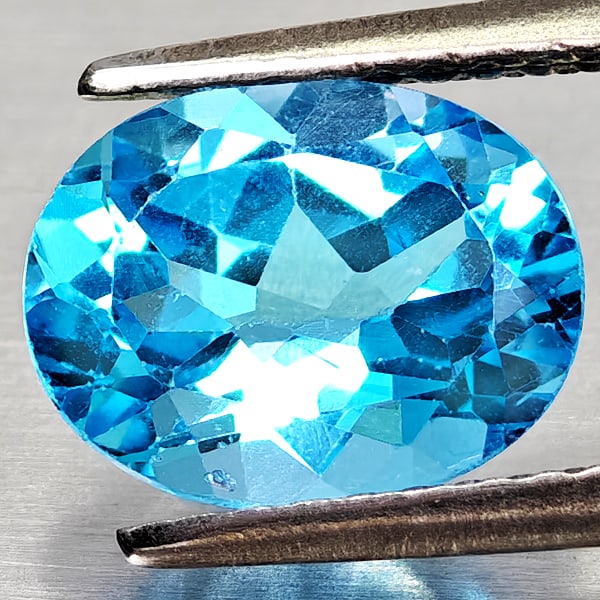 Natural Swiss Blue Topaz 2.21 Ct. Oval Shape 9 x 7.1 Mm Gemstone From Brazil: Product ID: 807168136 Product Name: Natural Blue Topaz Weight: 2.21 CT. Size: 9 x 7.1 x 4.6 MM. Shape: Oval Shape Color: Swiss Blue Clarity:VVS - VSI Luster: Good Gems Origin: Brazil Treatment: Treate