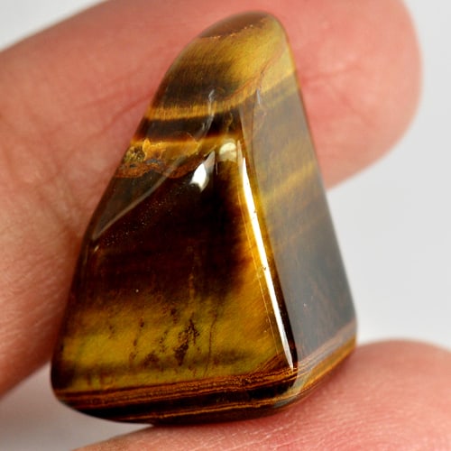 Natural Tiger Eye Agate 26.03 Ct. Fancy Cabochon Shape Gemstone From Madagascar: Product ID: 860000599 Product Name: Natural Agate Weight: 26.03 CT. Size: 20 x 15 x 11.7 MM. Shape: Fanc Cabochon Color: Yellow Clarity:Opaque Luster: Good Gems Origin: Madagascar Treatment: Unheated