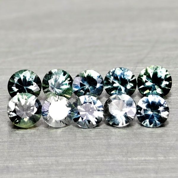 Natural Fancy Color Sapphire 0.68 Ct. 10 Pcs Round Diamand Cut 2.6 Mm Gemstones From Tanzania: Product ID: 806162292 Product Name: Natural Green Sapphire Weight: 0.68 CT. Size: 2.6 x 2.6 x 1.7 MM. Shape: Round Diamond Cut Color: Fancy Color Clarity:VSI Luster: Very Good Gems Origin: Tanzania Tr