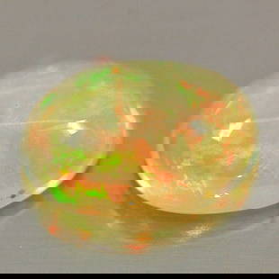 Natural Multi Color Play Of Colour Opal 0.81 Ct. Oval Cabochon Shape 8 x 6 Mm Gemstone from Ethiopia: Product ID: 818726325 Product Name: Natural Opal Weight: 0.81 CT. Size: 8 x 6 x 3.6 MM. Shape: Oval Cabochon Color: Multi Color Clarity:Semi - Transparent Luster: Iridescent Gems Origin: Ethiopia Trea