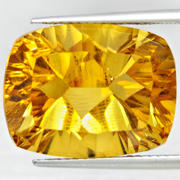 Natural Yellow Citrine 14.53 Ct. Cushion Concave Cut 17.5 x 13.5 Mm Gemstone From Brazil: Product ID: 801815396 Product Name: Natural Citrine Weight: 14.53 CT. Size: 17.5 x 13.5 x 10.4 MM. Shape: Cushion Concave Cut Color: Yellow Clarity:VSI Luster: Good Gems Origin: Brazil Treatment: Unhe