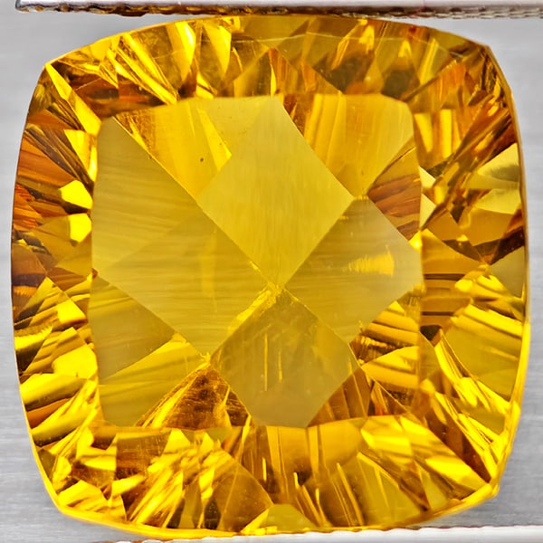 Natural Yellow Citrine 14.21 Ct. Cushion Concave Cut 15.4 x 15.4 Mm Gemstone From Brazil: Product ID: 801815401 Product Name: Natural Citrine Weight: 14.21 CT. Size: 15.4 x 15.4 x 9.6 MM. Shape: Cushion Concave Cut Color: Yellow Clarity:VSI Luster: Good Gems Origin: Brazil Treatment: Unhea