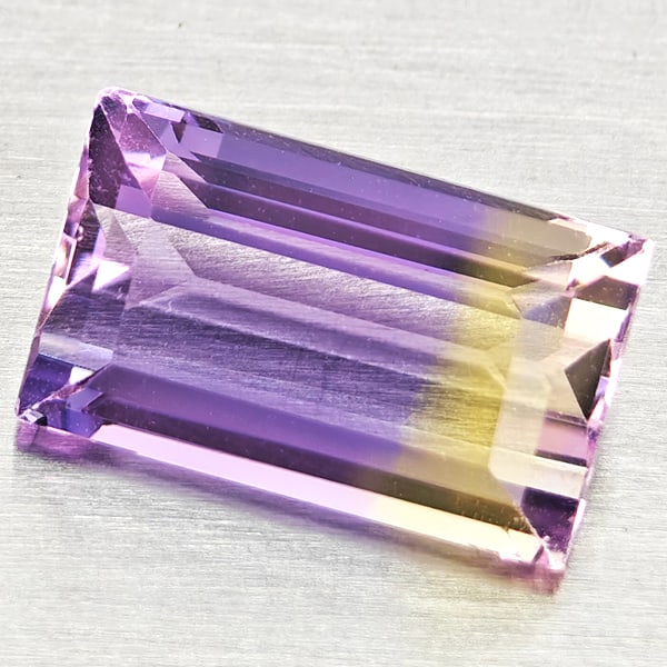 Natural Bi Color Ametrine 2.36 Ct. Baguette Shape 10.2 x 6.2 Mm Gemstone From Bolivia: Product ID: 800408468 Product Name: Natural Ametrine Weight: 2.36 CT. Size: 10.2 x 6.2 x 4.7 MM. Shape: Baguette Color: Bi Color Clarity:VSI Luster: Good Gems Origin: Bolivia Treatment: Unheated Cryst