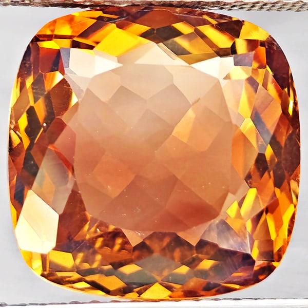 Natural Imperial Topaz 9.15 Ct. Cushion Shape 12.4 Mm Gemstone From Brazil: Product ID: 807168590 Product Name: Natural Topaz Weight: 9.15 CT. Size: 12.4 x 12.4 x 6.6 MM. Shape: Cushion Shape Color: Imperial Clarity:VSI Luster: Good Gems Origin: Brazil Treatment: Treated Crys