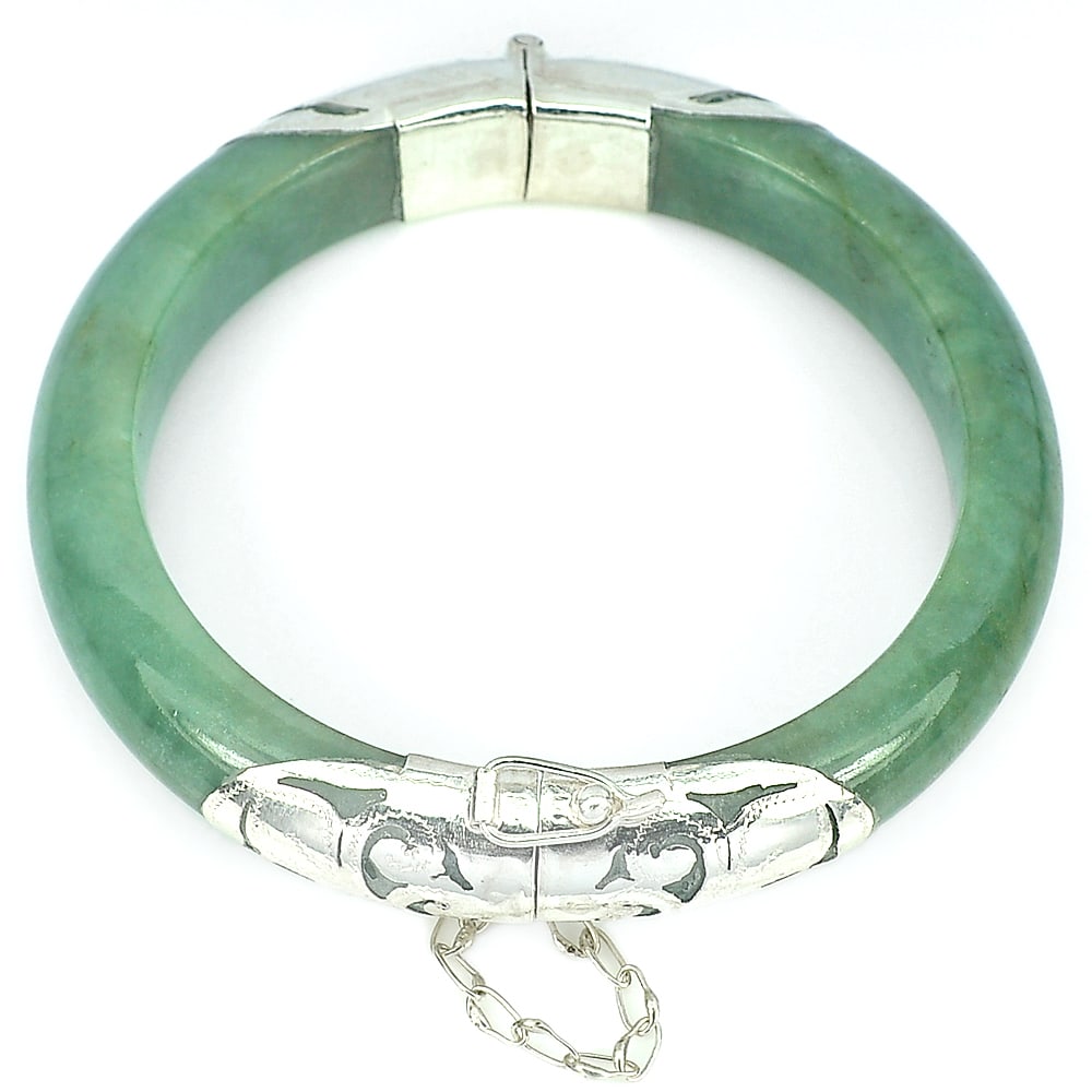 Natural Green Jade 282.32 Ct. Bangle Round Shape 75 x 59 Mm with Silver Diameter 59 mm. Gemstone: Product ID: 819813191 Product Name: Natural Jade Weight: 282.32 CT. Size: 75 x 59 x 11 MM. Shape: Round Cabochon Color: Green Clarity:Opaque Luster: Good Gems Origin: Thailand Treatment: Unheated Crys
