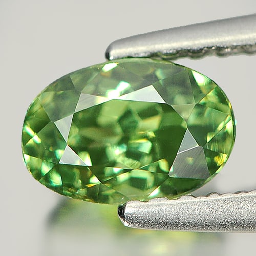 Natural Green Demantoid Garnet 1.06 Ct. Oval Shape 6.59 x 4.51 Mm. Gemstone Unheated From Madagascar: Product ID: 802915639 Product Name: Natural Demantoid Weight: 1.06 CT. Size: 6.59 x 4.51 x 4.13 MM. Shape: Oval Color: Green Clarity:VSI Luster: Very Good Gems Origin: Madagascar Treatment: Unheated C