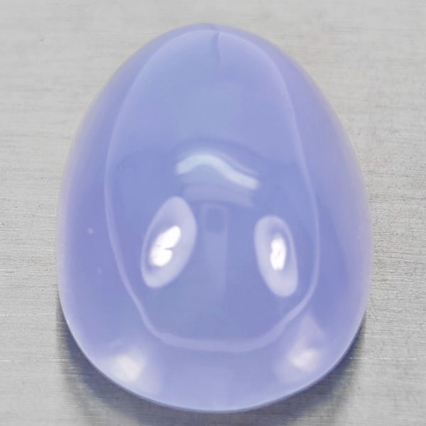 Natural Lavender Chalcedony 26.26 Ct. Oval Cabochon Shape 20 x 15.1 Mm Gemstone From Russia: Product ID: 801502715 Product Name: Natural Chalcedony Weight: 26.26 CT. Size: 20 x 15.1 x 12.6 MM. Shape: Oval Cabochon Color: Lavender Clarity:Semi - Transparent Luster: Good Gems Origin: Russia Tre