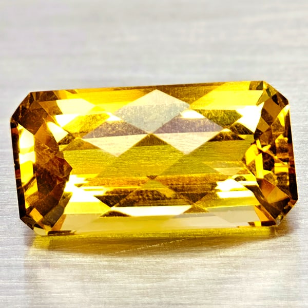 Natural Yellow Citrine 6.94 Ct. Octagon Checkerboard Cut 15.5 x 8.1 Mm Gemstone From Brazil: Product ID: 801815113 Product Name: Natural Citrine Weight: 6.94 CT. Size: 15.5 x 8.1 x 7.8 MM. Shape: Octagon Checkerboard Cut Color: Yellow Clarity:VSI Luster: Good Gems Origin: Brazil Treatment: Un