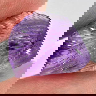 Purple Amethyst 6.39 Ct. Fish Carving 14.4 x 11.4 Mm. Natural Gemstone Unheated From Brazil: Product ID: 810303310 Product Name: Natural Amethyst Weight: 6.39 CT. Size: 14.4 x 11.4 x 7 MM. Shape: Fish Carving Color: Purple Clarity:Semi - Transparent Luster: Good Gems Origin: Brazil Treatment: