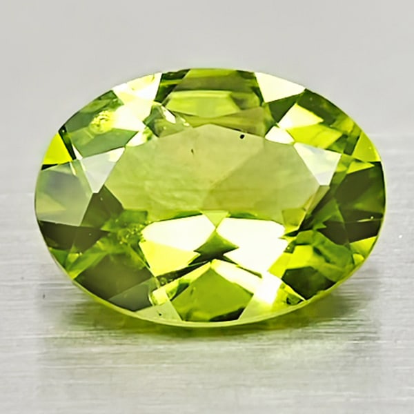 Natural Green Peridot 1.31 Ct. Oval Shape 8 x 6 Mm. Gemstone From Pakistan: Product ID: 805316975 Product Name: Natural Peridot Weight: 1.31 CT. Size: 8 x 6 x 3.9 MM. Shape: Oval Color: Green Clarity:VSI Luster: Good Gems Origin: Pakistan Treatment: Unheated Crystal Structure