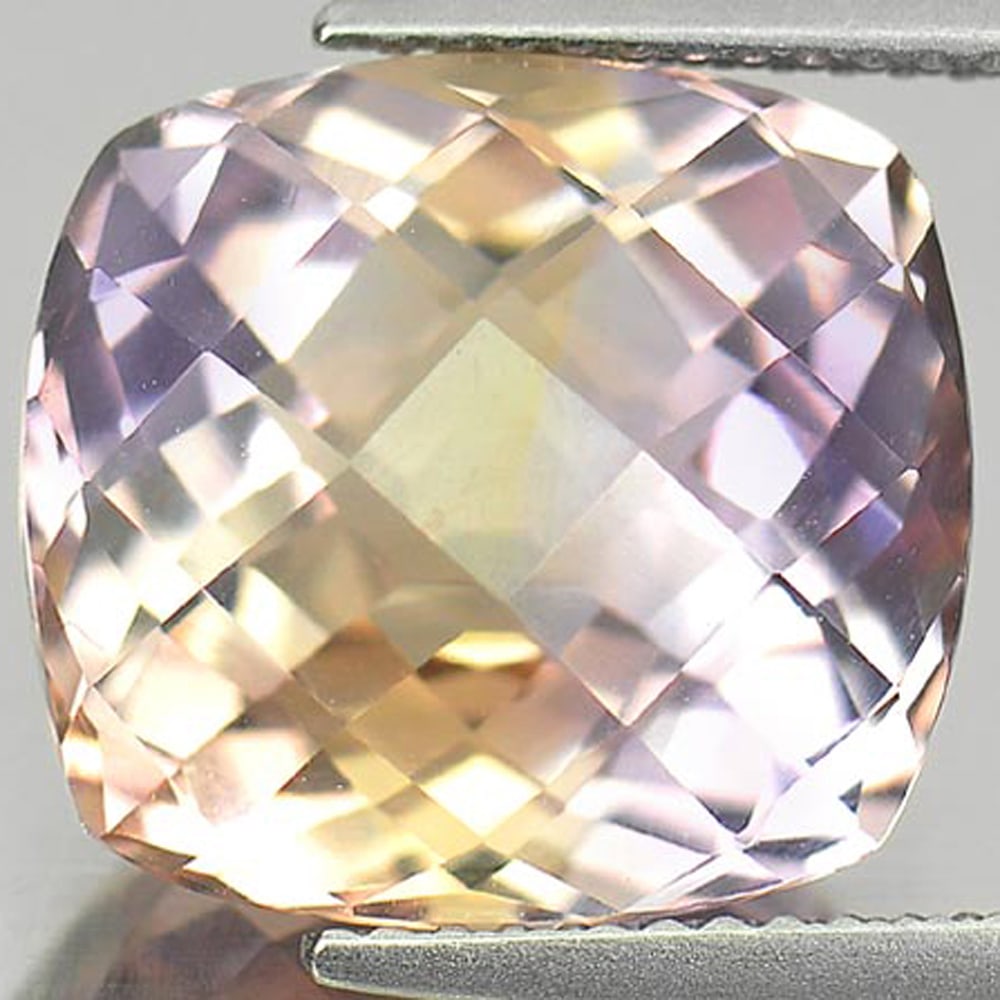 Natural Bi Color Ametrine 8.76 Ct. Clean Cushion Checkerboard Cut 13.5 x 12.5 Mm. Gemstone: Product ID: 800407098 Product Name: Natural Amethyst Weight: 8.76 CT. Size: 13.5 x 12.5 x 8.8 MM. Shape: Cushion Checkerboard Color: Bi-Color Clarity:IF Luster: Very Good Gems Origin: Bolivia Treatmen