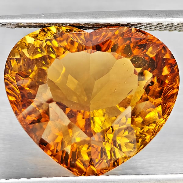 Natural Imperial Topaz 12.29 Ct. Heart Concave Cut 14.3 x 12.7 Mm Gemstone From Brazil: Product ID: 807168634 Product Name: Natural Topaz Weight: 12.29 CT. Size: 14.3 x 12.7 x 9.5 MM. Shape: Heart Shape Color: Imperial Clarity:VSI Luster: Good Gems Origin: Brazil Treatment: Treated Cryst