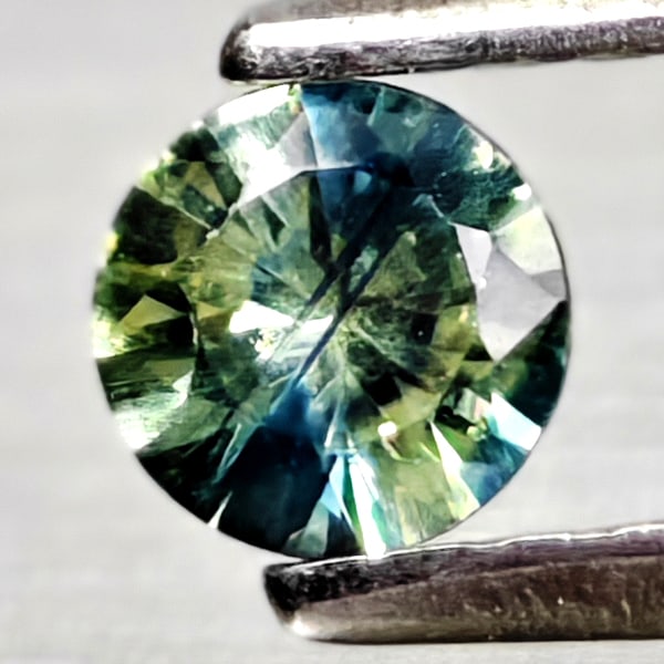 Natural Fancy Color Sapphire 0.24 Ct. Round Diamand Cut 3.9 Mm Gemstones From Tanzania: Product ID: 806162185 Product Name: Natural Green Sapphire Weight: 0.24 CT. Size: 3.9 x 3.9 x 2.3 MM. Shape: Round Diamond Cut Color: Fancy Color Clarity:VSI Luster: Very Good Gems Origin: Tanzania Tr
