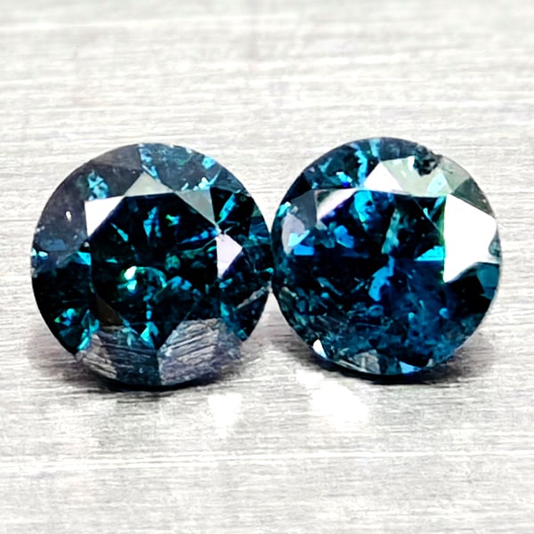 Natural Blue Loose Diamond 0.15 Ct. 2 Pcs Round Diamond Cut 2.5 Mm From Belgium: Product ID: 502100374 Product Name: Natural Natural Diamond Weight: 0.15 CT. Size: 2.5 x 2.5 x 1.7 MM. Shape: Round Diamond Cut Color: Blue Clarity:SI1 Luster: Good Gems Origin: Belgium Treatment: Tre
