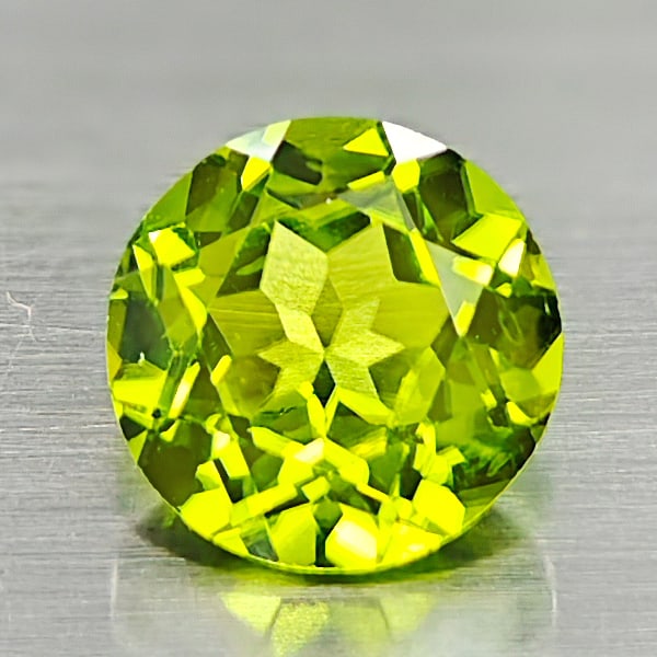 Natural Green Peridot 2.06 Ct. Round Shape 8 Mm Gemstone From Thailand: Product ID: 805316904 Product Name: Natural Peridot Weight: 2.06 CT. Size: 8 x 8 x 4.8 MM. Shape: Round Color: Green Clarity:VSI Luster: Good Gems Origin: Thailand Treatment: Unheated Crystal Structur