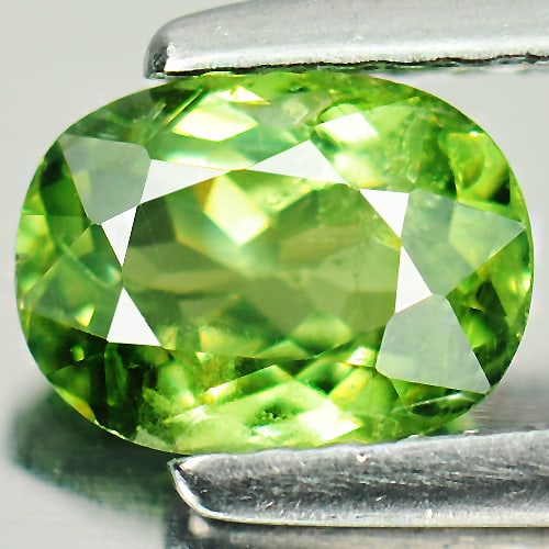 Natural Green Demantoid Garnet 0.97 Ct. Oval Shape 6.8 x 5.1 Mm. Gemstone From Mardagascar: Product ID: 802922209 Product Name: Natural Demantoid Weight: 0.97 CT. Size: 6.8 x 5.1 x 3.2 MM. Shape: Oval Color: Green Clarity:SI Luster: Very Good Gems Origin: Mardagascar Treatment: Unheated Crys