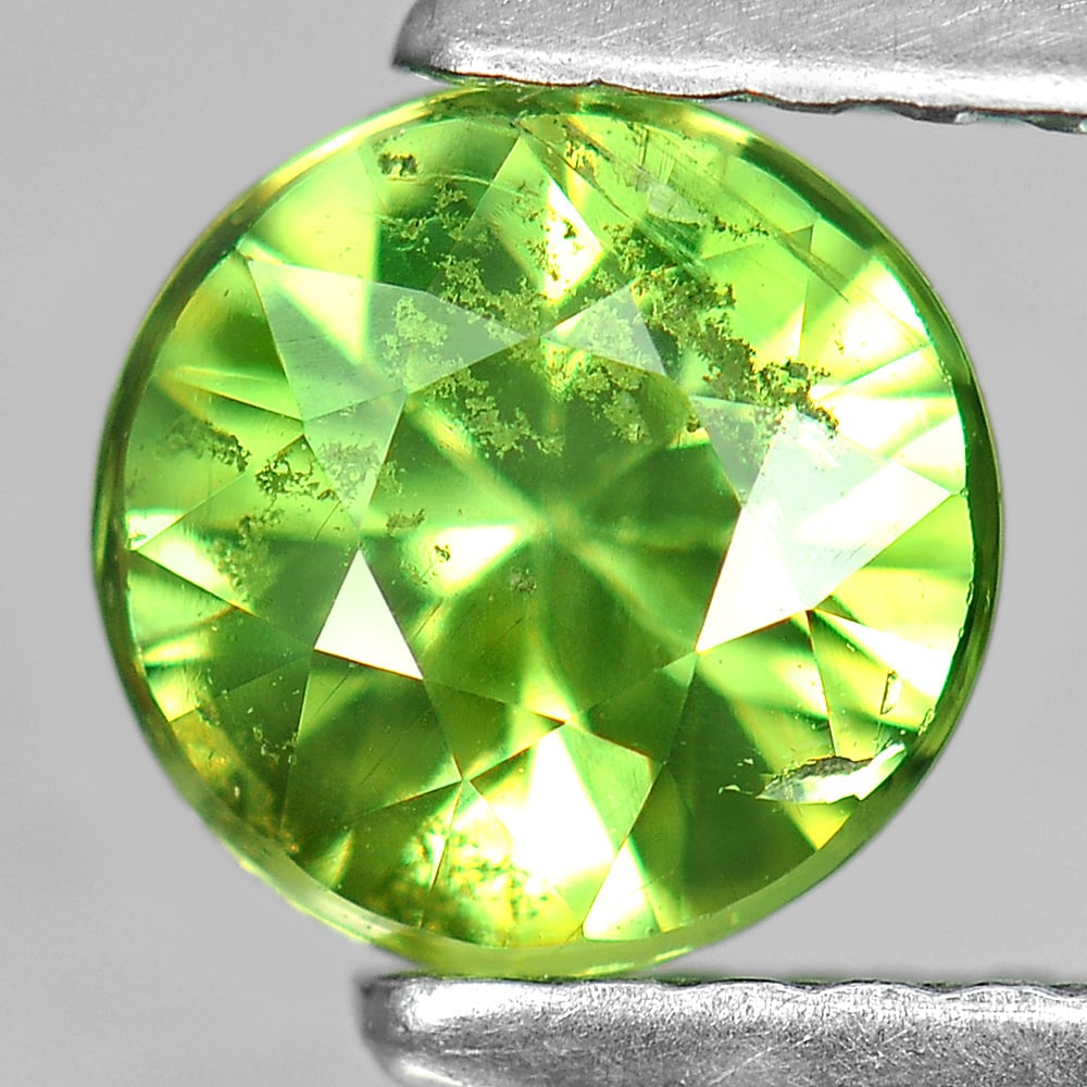 Natural Green Demantoid Garnet 1.00 Ct. Round Shape 5.9 Mm. Gemstone From Madagascar: Product ID: 802927336 Product Name: Natural Demantoid Weight: 1.00 CT. Size: 5.9 x 5.9 x 4.1 MM. Shape: Round Color: Green Clarity:SI Luster: Good Gems Origin: Madagascar Treatment: Unheated Crystal S