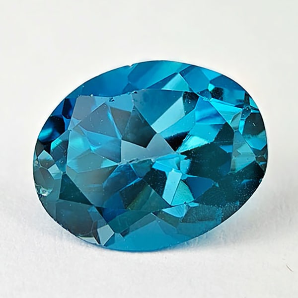 Natural London Blue Topaz 2.28 Ct. Oval Shape 9 x 7 Mm. Gemstone From Brazil: Product ID: 807167796 Product Name: Natural Blue Topaz Weight: 2.28 CT. Size: 9 x 7 x 5 MM. Shape: Oval Color: London Blue Clarity:VSI Luster: Good Gems Origin: Brazil Treatment: Treated Crystal Struc