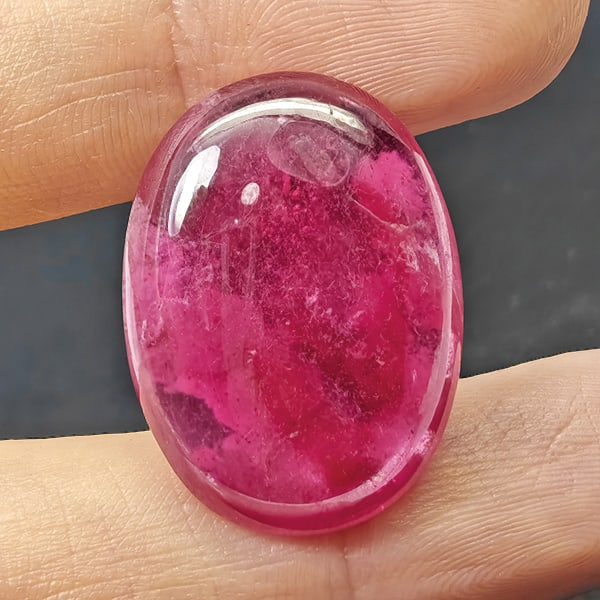 Natural Pink Red Ruby 24.87 Ct. Oval Cabochon Shape 23 x 17 Mm Gemstone From Madagascar: Product ID: 805935334 Product Name: Natural Ruby Weight: 24.87 CT. Size: 23 x 17 x 5.4 MM. Shape: Oval Cabochon Color: Purplish Red Clarity:Opaque Luster: Good Gems Origin: Madagascar Treatment: Heate