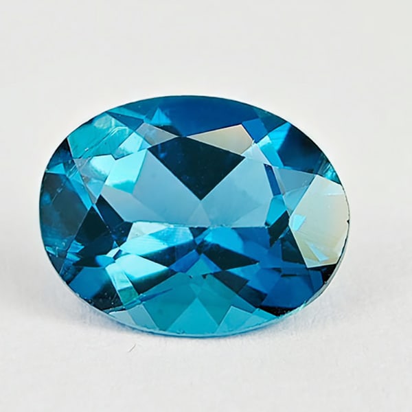 Natural London Blue Topaz 2.23 Ct. VVS Oval Shape 9 x 7 Mm. Gemstone From Brazil: Product ID: 807167792 Product Name: Natural Blue Topaz Weight: 2.23 CT. Size: 9 x 7 x 4.7 MM. Shape: Oval Color: London Blue Clarity:VVS Luster: Good Gems Origin: Brazil Treatment: Treated Crystal Str