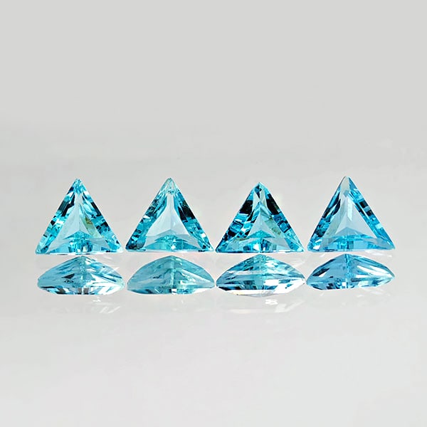 Natural Swiss Blue Topaz 2.02 Ct. 4 Pcs. VVS Trilliant Shape 5.5 x 5.5 Mm. Gemstones From Brazil: Product ID: 807167772 Product Name: Natural Blue Topaz Weight: 2.02 CT. Size: 5.5 x 5.5 x 3.8 MM. Shape: Trilliant Color: Blue Clarity:VVS Luster: Good Gems Origin: Brazil Treatment: Treated Crystal S