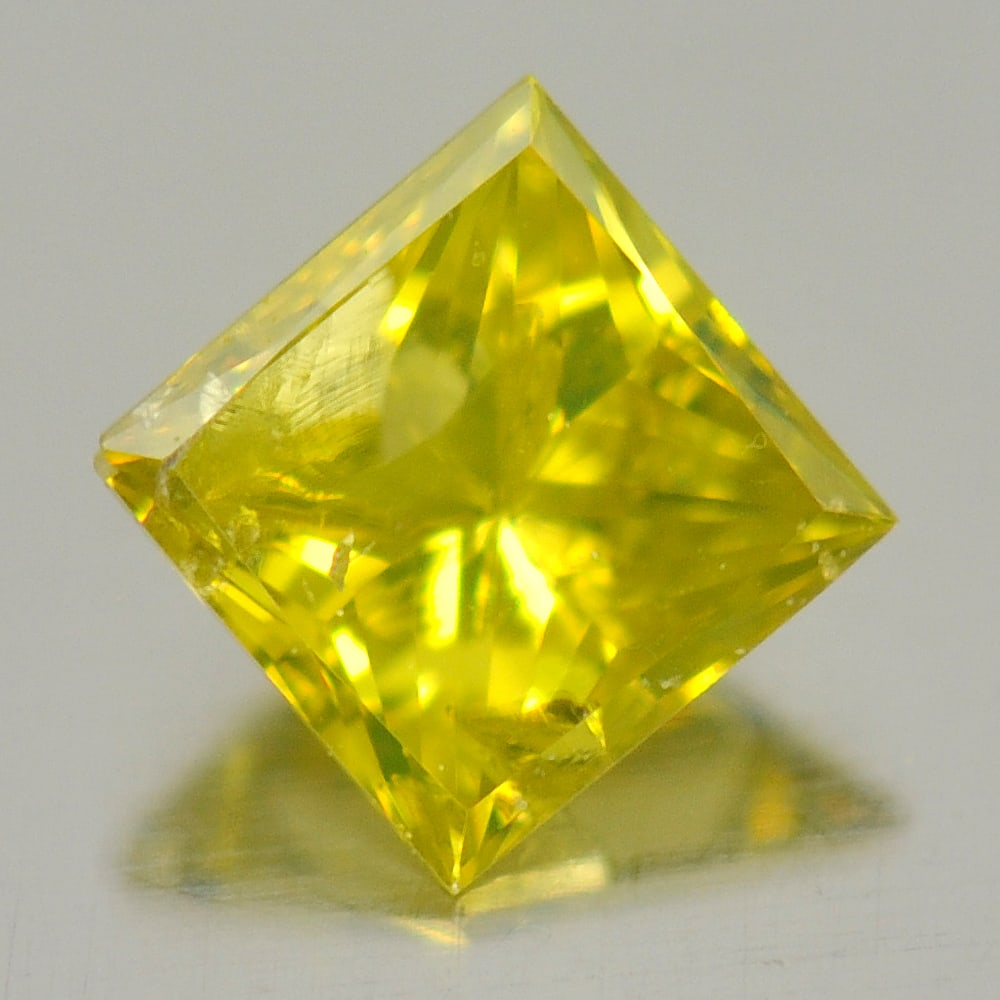 Natural Yellow Loose Diamond 0.16 Ct. Square Princess Cut Shape 3 x 3 Mm. From Belgium: Product ID: 802103703 Product Name: Natural Enhanced Diamond Weight: 0.16 CT. Size: 3 x 3 x 2.1 MM. Shape: Square Princess Cut Color: Yellow Clarity:SI1 Luster: Scintillating Gems Origin: Belgium Trea