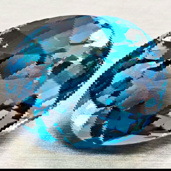 Natural London Blue Topaz 5.84 Ct. Oval Shape 11.5 x 9.5 Mm Gemstone From Brazil: Product ID: 807168416 Product Name: Natural Blue Topaz Weight: 5.84 CT. Size: 11.5 x 9.5 x 6.9 MM. Shape: Oval Color: London Blue Clarity:VVS - VSI Luster: Very Good Gems Origin: Brazil Treatment: Tre