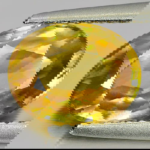 Natural Yellow Zircon 2.56 Ct. Oval Shape 9.1 x 7.1 Mm. Gemstone From Cambodia: Product ID: 807729748 Product Name: Natural Zircon Weight: 2.56 CT. Size: 9.1 x 7.1 x 3.8 MM. Shape: Oval Color: Yellow Clarity:VSI Luster: Good Gems Origin: Cambodia Treatment: Heated Crystal Structu