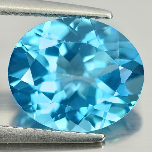 Natural Swiss Blue Topaz 5.07 Ct. VVS Oval Shape 12 x 10 Mm. Gemstone From Brazil: Product ID: 807161158 Product Name: Natural Blue Topaz Weight: 5.07 CT. Size: 12 x 10 x 6 MM. Shape: Oval Color: Blue Clarity:VVS Luster: Very Good Gems Origin: Brazil Treatment: Treated Crystal Struc