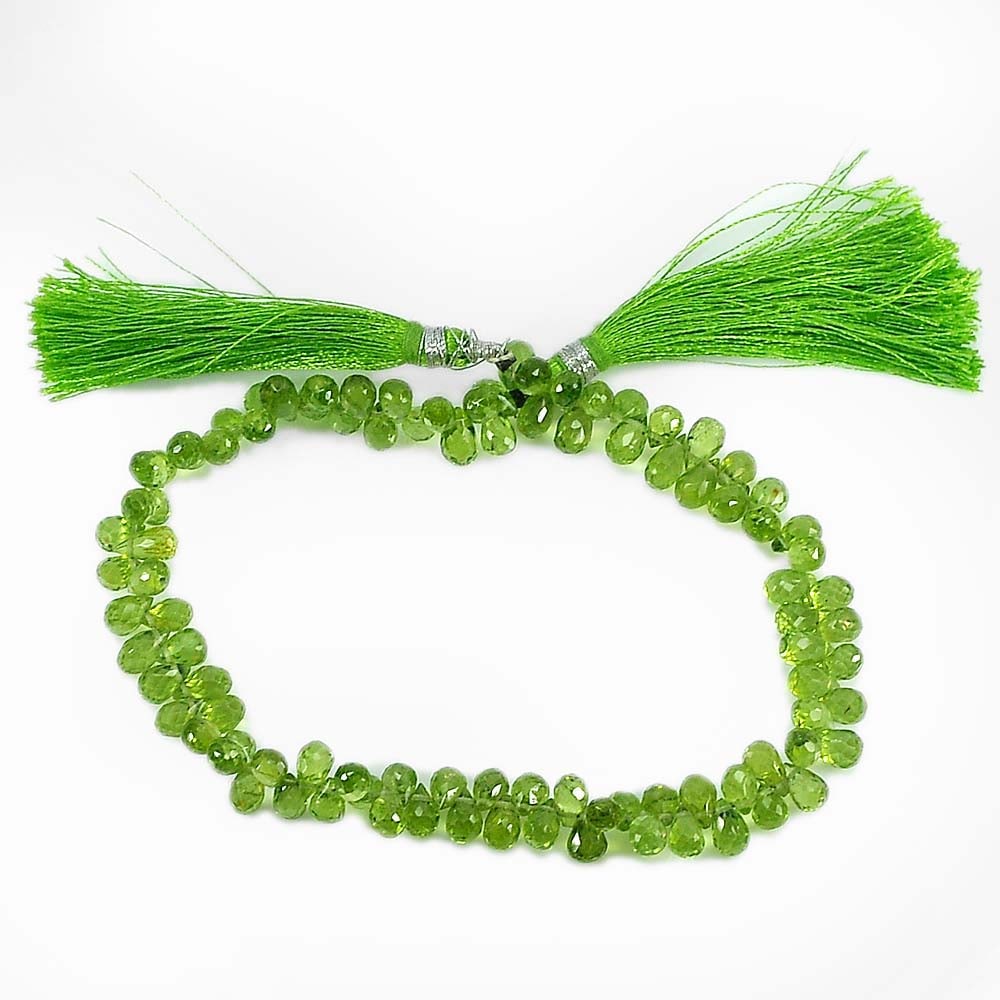 Natural Green Peridot 93.40 Ct. Briolette Size 6.6 x 4.2 Mm. Beads 9 Inch. Gemstone From Thailand: Product ID: 805306822 Product Name: Natural Peridot Weight: 93.40 CT. Size: 9 Inch. / 6.6 x 4.2 MM. Shape: Briolette Color: Green Clarity:VVS Luster: Good Gems Origin: Thailand Treatment: Unheated Cry