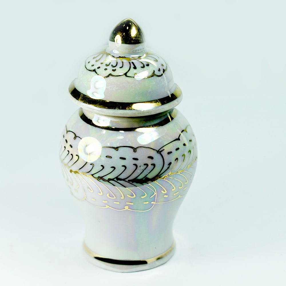 Reliquary Casket Porcelain Ceramic Material Made by Heating Weight 386.98 Ct.: Product ID: 810000003 Product Name: Natural Gift Weight: 386.98 CT. Size: 50 x 50 x 90 MM. Shape: None Color: Multi Color Clarity:Opaque Luster: none Gems Origin: Thailand Treatment: heated Crystal St