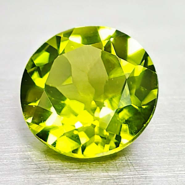 Natural Green Peridot 2.04 Ct. Round Shape 8 Mm. Gemstone From Thailand: Product ID: 805316896 Product Name: Natural Peridot Weight: 2.04 CT. Size: 8 x 8 x 4.5 MM. Shape: Round Color: Green Clarity:VSI Luster: Good Gems Origin: Thailand Treatment: Unheated Crystal Structur