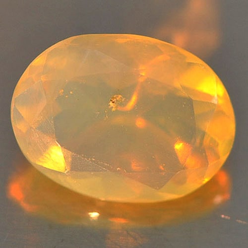 Natural Play Of Colour Multi Color Opal 0.68 Ct. Oval Shape 8 x 6 Mm Gemstone from Ethiopia: Product ID: 818726220 Product Name: Natural Opal Weight: 0.68 CT. Size: 8 x 6 x 3.9 MM. Shape: Oval Color: Multi Color Clarity:Semi - Transparent Luster: Iridescent Gems Origin: Ethiopia Treatment: Un